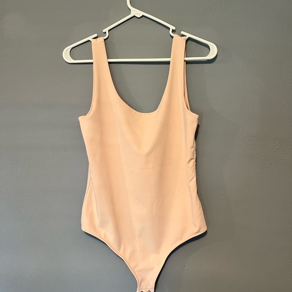 Body contouring body suit